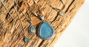 pre-loved-sea-glass-necklaces-on-wood