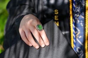green-class-ring-posed-with-grad-cap