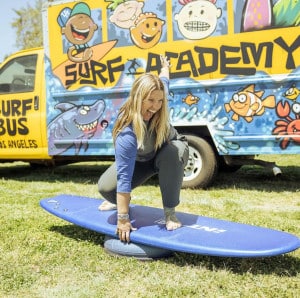 marion-posing-on-a-surfboard